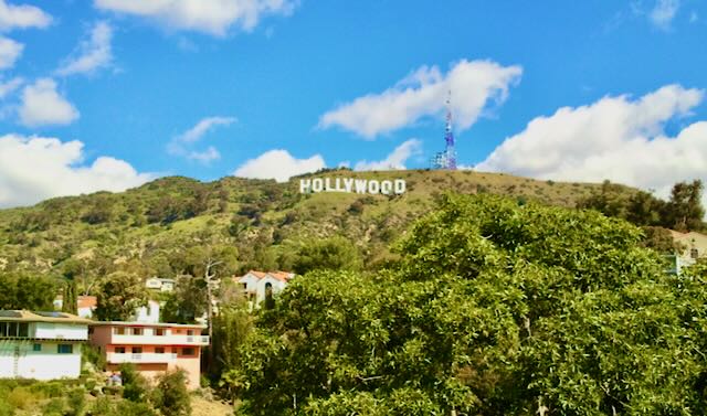 Daytime view of the Hollywood sign above the hills — location scouting for an LA-based shoot.